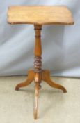 A 19thC shaped mahogany side table raised on a stepped turned support and tripod base, W44 D37