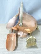 A copper helmet shaped coal scuttle and shovel, H46cm