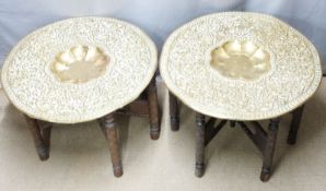 Two Oriental carved tables with brass tops, diameter 77cm