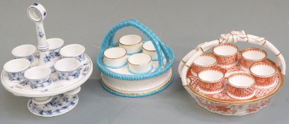 Three egg cruets including Spode, Royal Worcester and a Dresden example, tallest 19cm