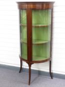 Edwardian glazed inlaid mahogany cabinet with bowed glass door, raised on three splayed legs, W76