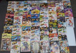 Eighty-four volumes of Alter-Ego comic book magazine.