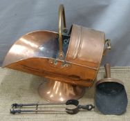A copper coal scuttle and accessories