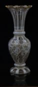 Bohemian overlaid and cut glass pedestal vase with gilt decoration of flowers on white casing over a