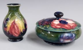 Moorcroft pedestal covered bowl in Anenome pattern and a pedestal vase in the Leaf and Berry