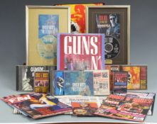 Guns N' Roses memorabilia including CDs, cassettes, Use Your Illusion tour programme, newspapers,