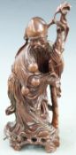 20thC Chinese wooden figure of a wise man, 29cm tall