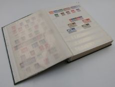 A stockbook containing a mint and used QEII collection