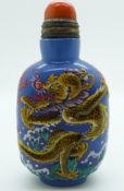 Chinese glass scent bottle with raised enamel dragon decoration, four character mark to base and