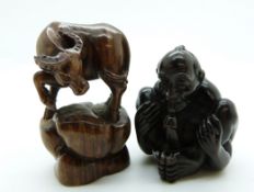 Japanese erotic netsuke and another netsuke depicting a water buffalo, both signed
