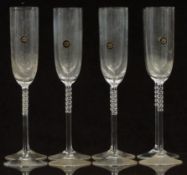 A set of eight Rosenthal Studio-Line champagne flutes with bobbled stems, 27cm tall
