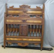 A walnut double bed with carved detail and spring base, W137 x H159cm