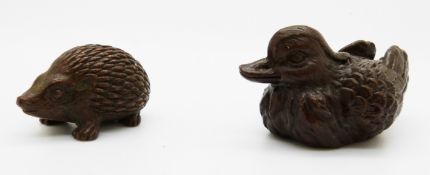 Japanese bronzes of a hedgehog and a duck, with marks to base