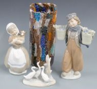 Three Nao figures and a glass vase, tallest 25cm