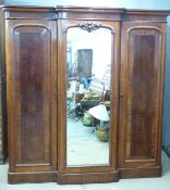 19thC mahogany breakfront triple wardrobe with fitted interior including slides, campaign style