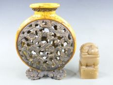 A large Chinese carved hardstone seal (13cm tall) and a pierced moon flask, tallest 27cm