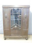 A 19thC glazed twin door display cabinet with adjustable shelves, raised on cabriole legs, W131 x