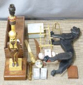 Egyptian Revival table lamp, articulated toy panther, miniature metal easels, novelty paper knife,