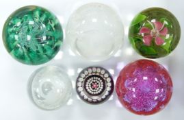 Five Caithness glass paperweights comprising Seaform, Miniature Rose, Celebration, Silver Jubilee