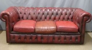 A red leather three seat Chesterfield sofa, W190 x D82 x H76cm