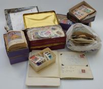 A quantity of loose stamps in boxes and packets, and sundry items