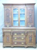 Art Nouveau oak sideboard with carved decorative panels and pierced stylised copper / brass handles,