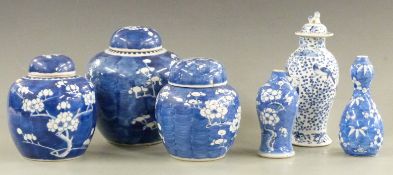 Five 19thC/20thC Chinese ginger jars and vases decorated with prunus blossom, some with marks to