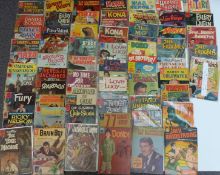 Sixty-two Dell comics comprising including The Young Lawyers, Daniel Boone, Charlie Chan, Smokey The
