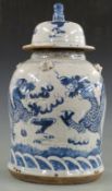 Chinese blue and white jar with dragon decoration and Foo dog finial, 48cm tall