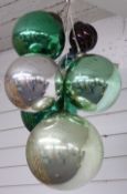 Six glass witch's balls or oversized baubles, diameter of largest approximately 25cm, and a small