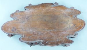 A 19thC Chinese carved rosewood stand of shaped form raised on pierced scrolling legs, W52 x D28 x