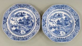 A pair of 19thC Chinese blue and white octagonal export plates decorated with landscapes and