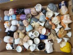 Approximately 40 mostly figural egg cups mostly Barstow Manor including Spitting Image, Goebel etc