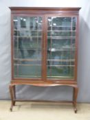An oak glazed display cabinet, W132 x D39 x H183cm