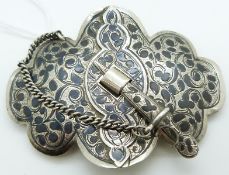 A white metal Russian Neillo buckle marked 84
