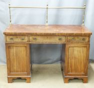 A 19thC twin pedestal mahogany desk with brass rail, W137 x D57 x H127cm (with rail)