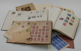 Four albums and a folder of GB and all-world stamps including large blocks of GB 1940 centenary