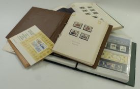 Three stamp albums of mint GB stamps, presentation packs and first day covers, face value at