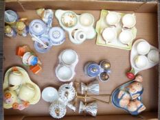 Approximately twelve novelty egg cruets including Goebel monkey, Japanese, salad ware etc, tallest