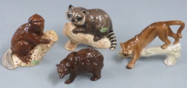 Beswick brown bear, racoon and beaver and a Goebel cougar, tallest 11cm