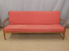 France & Co retro Danish teak sofa with original red geometric design cushions, length 197cm