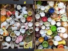 Approximately 80 novelty egg cups including kitsch, retro etc