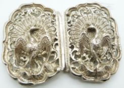 An Indian white metal buckle in the form of peacocks
