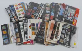 A large collection of GB presentation packs loose and in three albums