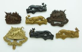 Seven West African Regiment metal badges
