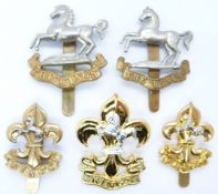 Five British Army King's Manchester Regiment / King's Liverpool Regiment cap badges