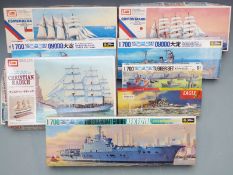 Eight plastic model ship kits comprising three IMAI 1:350 scale, Eagle Bismarck and four Fujimi 1: