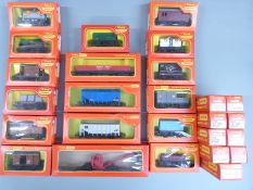 Twenty-six Tri-ang Hornby 00 gauge wagons, vans and trucks, all in original boxes.
