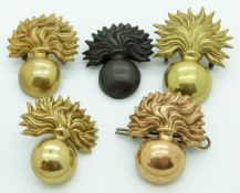 Five British Army Grenadier Guards other ranks metal forage cap badges, one in bronze