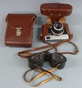 A pair of Carl Zeiss Jenoptem 8x30w binoculars together with a Werra camera having Carl Zeiss Tessar